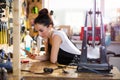 Young woman working in a bicycle repair shop Royalty Free Stock Photo