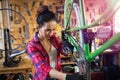 Young woman working in a bicycle repair shop Royalty Free Stock Photo