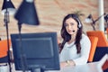 Young woman working in call centre, surrounded by colleagues Royalty Free Stock Photo