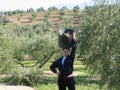 Young woman working in the field burning olive branches Royalty Free Stock Photo