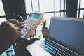 The young woman is working on a financial account to prepare to be promoted to the head of the account