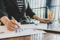 The young woman is working on a financial account to prepare to be promoted to the head of the account