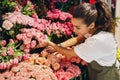 Young woman working in a flower shop Royalty Free Stock Photo