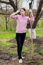 Young woman working in the garden. Royalty Free Stock Photo