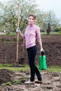 Young woman working in the garden. Royalty Free Stock Photo