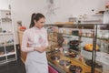 Young woman working at her vegan confectionery store