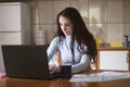 Young woman working from home on her laptop Royalty Free Stock Photo