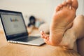 Young woman working from home on a laptop computer Royalty Free Stock Photo