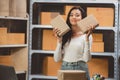 Young woman working at home for packeting parcel boxes to shipping delivery services to customer Royalty Free Stock Photo