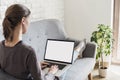 Young woman working at home. Student girl using laptop computer. Online shopping, work or studying from home concept Royalty Free Stock Photo