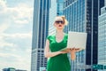 Young woman working on laptop computer outdoors in New York City Royalty Free Stock Photo