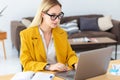 Young woman working with laptop Concentrated businesswoman at work sitting in the office Royalty Free Stock Photo