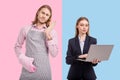 Young woman working on laptop while man holding rolling pin Royalty Free Stock Photo