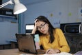 Young woman working on laptop in the office. Royalty Free Stock Photo