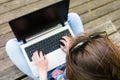 Young woman working on a laptop. View from above.