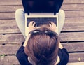 Young woman working on a laptop. View from above.