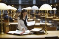 Young woman working in library Royalty Free Stock Photo