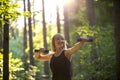 Young woman working out with weights