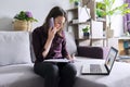 Young woman working remotely at home, business female freelancer Royalty Free Stock Photo