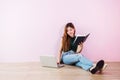 Young Woman Working or Studying on Laptop, Sit on the Floor and Royalty Free Stock Photo