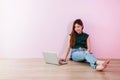 Young Woman Working or Studying on Laptop, Sit on the Floor and Royalty Free Stock Photo