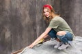 Young woman working with tape and preparing room for renovation home