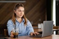 Young woman working use laptop and drink bubble tea in the restaurant