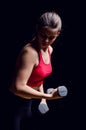 Young woman using dumbbells Royalty Free Stock Photo