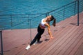 Young woman workout outdoor in the city promenade along the rive Royalty Free Stock Photo