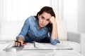 Young woman worried at home in stress accounting desperate in financial problems Royalty Free Stock Photo