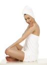 Young woman wrapped towel isolated on white background Royalty Free Stock Photo