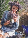 Young woman having picnic in lavender field Royalty Free Stock Photo