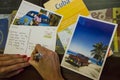 Young woman writes greeting cards from Cuba Royalty Free Stock Photo