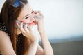 Young woman writes an SMS to your mobile phone Royalty Free Stock Photo