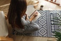 Young woman writing morning pages in diary,planning her business in the morning with notebook and pen in her hands Royalty Free Stock Photo