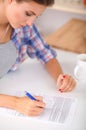 Young woman writing something in her note pad Royalty Free Stock Photo