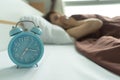 Young woman yawn awakening tired holding alarm clock. wake up ea Royalty Free Stock Photo