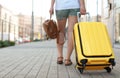 Young woman with yellow carry Royalty Free Stock Photo