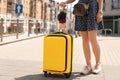 Young woman with yellow carry Royalty Free Stock Photo