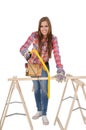 Young woman with yellow Hacksaw