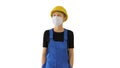 Young woman in yellow hardhat and in medical mask walking on whi Royalty Free Stock Photo