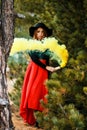 Young woman with a yellow smoke bomb Royalty Free Stock Photo