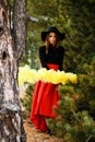 Young woman with a yellow smoke bomb Royalty Free Stock Photo