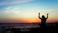 Young woman yoga silhouette meditation on the ocean coast Royalty Free Stock Photo