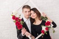 A young woman and young men in a romantic photo session.