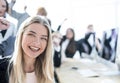 young woman on the background of a jubilant business team.