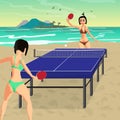 Young women in bikini play on the beach in table tennis. Girls i