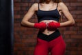 Young women boxing, the boxing bag. red bandage on hands Royalty Free Stock Photo