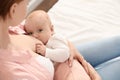 Young woman breast feeding her little baby Royalty Free Stock Photo