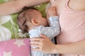 Young woman breastfeeding her baby at home. Milk from mother& x27;s breast is a natural medicine to baby. Mother day Royalty Free Stock Photo